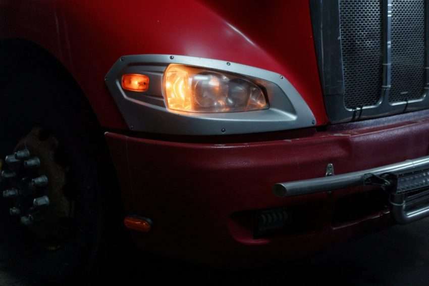 Photo by cottonbro studio: https://www.pexels.com/photo/close-up-of-red-truck-headlight-7019363/